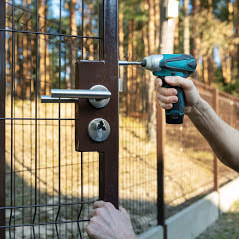 Delco Fencing Installing A Custom Latch And Lock On A Custom Concrete Footed Fence
