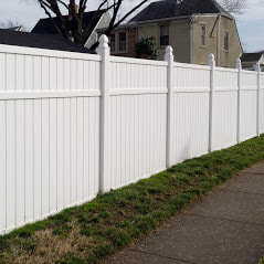 A Picture Of A Nice White Vinyl Fence Installed By Delco Fencing With A Different Type Of Post That Was A Custom Request By The Customer
